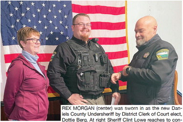 REX MORGAN (center) was sworn ….